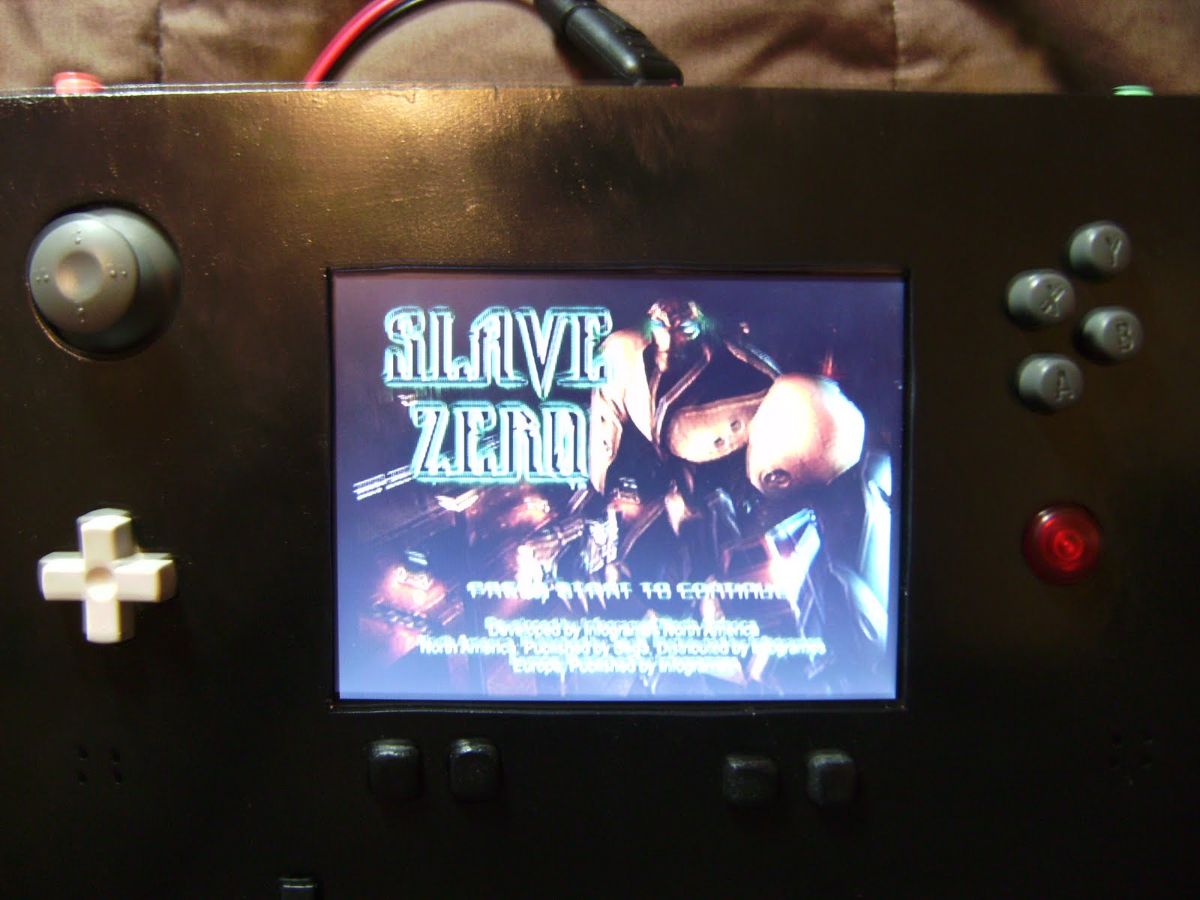 The portable playing the game Slave Zero
